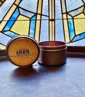 8oz Soy Blend Candle in front of one of the gorgeous stained glass windows in the Grand Hall. 